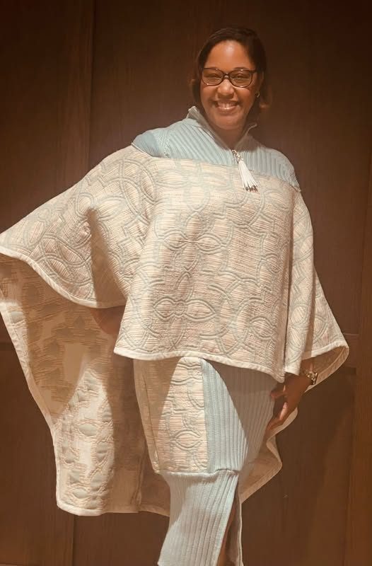 Cream textured cape over a matching outfit