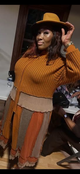 Rust sweater with patchwork skirt and felt hat